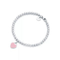 Tiffany & Co.: Pink Mini Heart Bead Bracelet in Silver with a Diamond, 4 mm